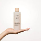 hand holding Anua Rice 70 Glow Milky Toner 250 mL