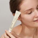 woman holding haruharu wonder Black Rice Bakuchiol Eye Cream