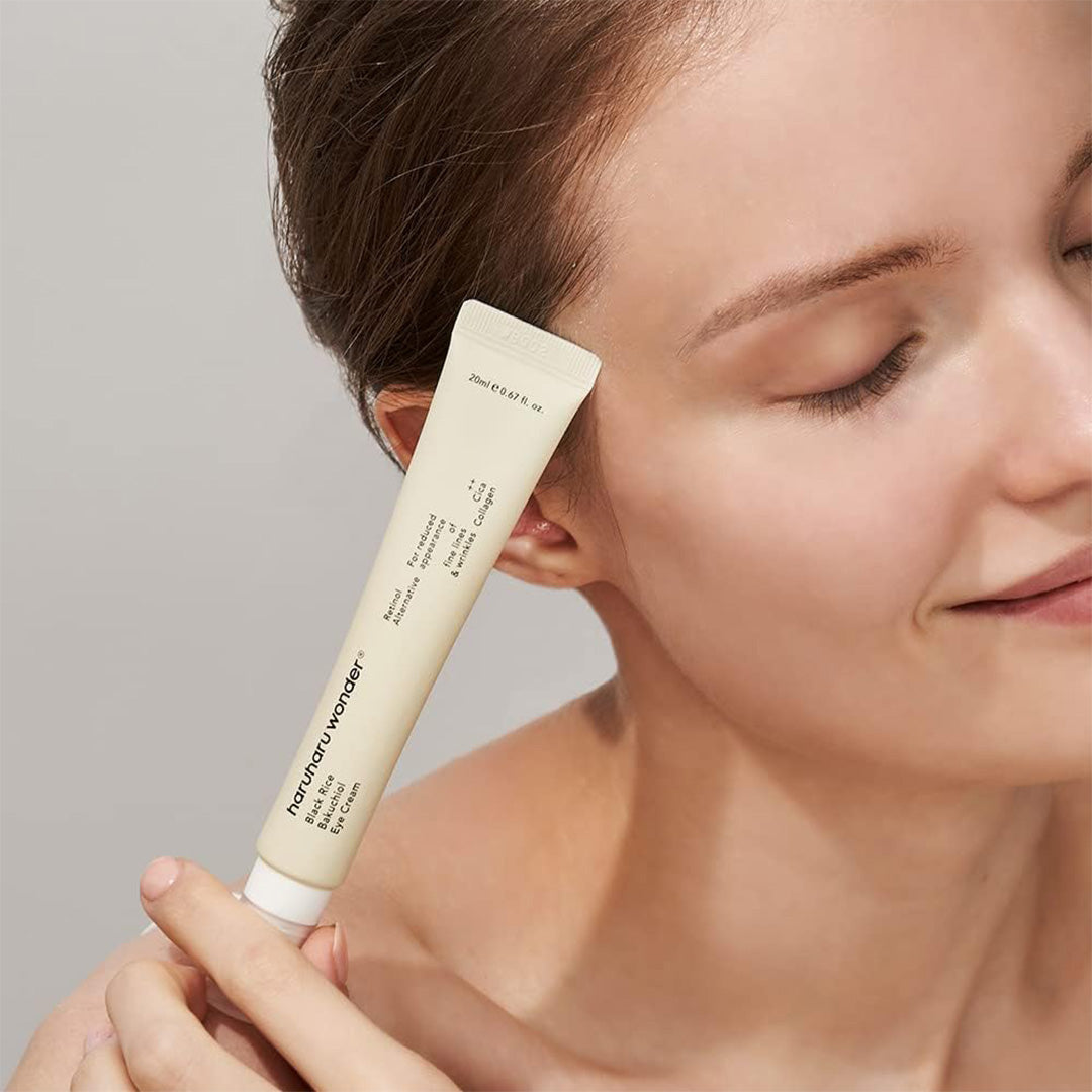 woman holding haruharu wonder Black Rice Bakuchiol Eye Cream