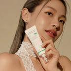 woman holding AXIS-Y Complete No-Stress Physical Sunscreen 50 mL