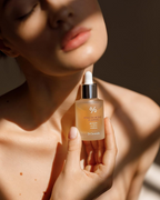 woman holding Dr.Ceuracle Royal Vita Propolis 33 Ampoule bottle
