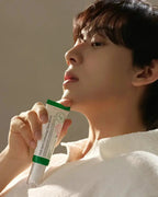 person holding AXIS-Y Vegan Collagen Eye Serum 