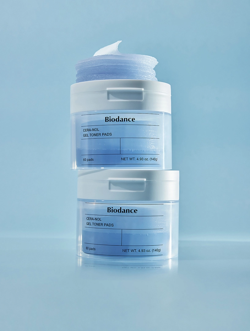BIODANCE Cera-nol Gel Toner Pads (60 Pads/140g) placed above two toner pad containers